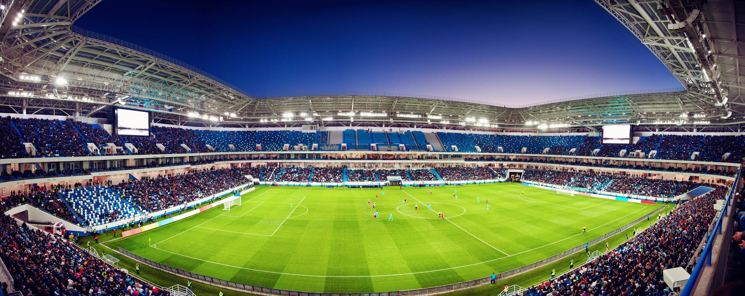 Voetbalstadion onder heldere nachtverlichting - LW00951 Fotobehang