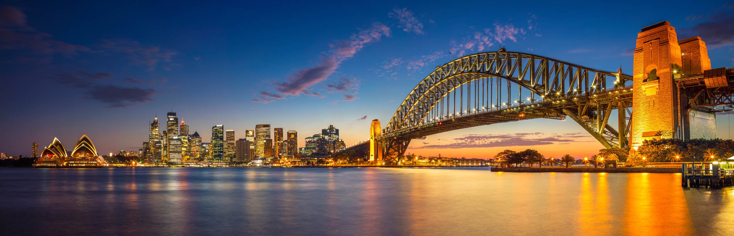 Sydney Harbour Bridge en het Opera House bij Schemering - LW00761 Fotobehang